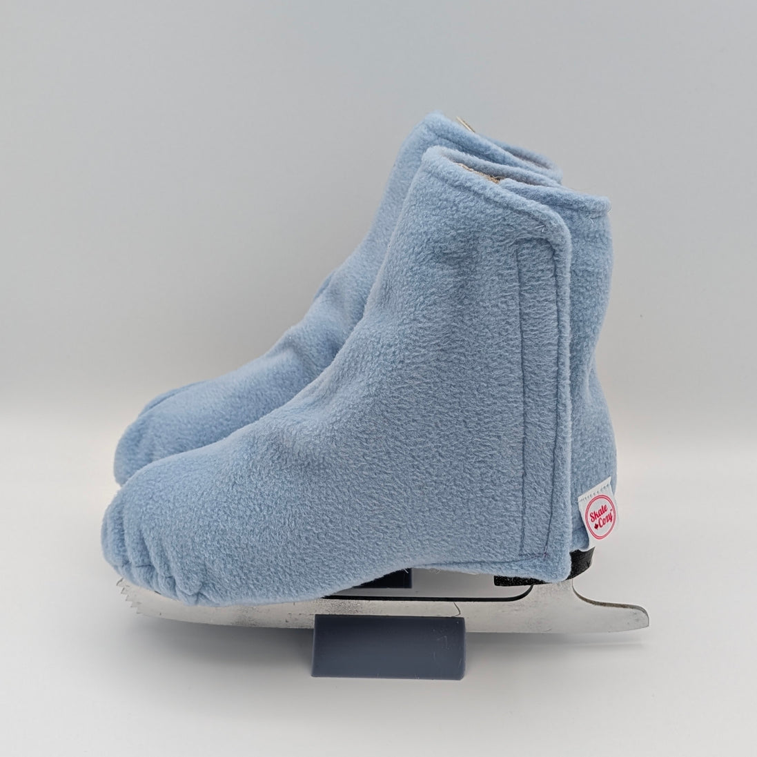 Periwinkle Blue fleece figure skate boot covers on a white background
